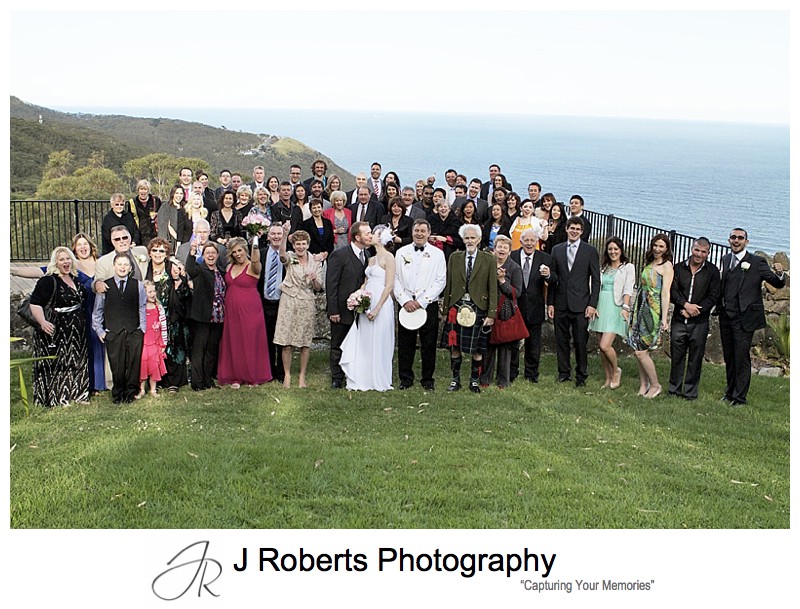 All the guests with Stanwell Tops in the background - sydney wedding photography 